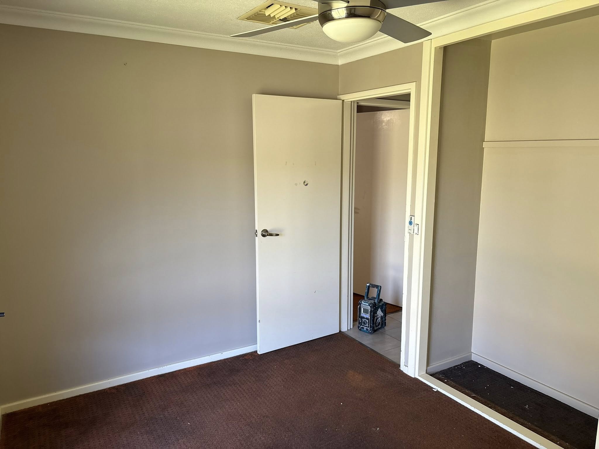 Bedroom after repainting over pink walls